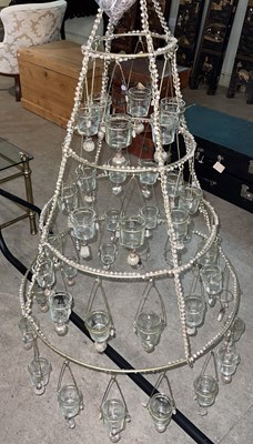 Lot 768 - A silvered metal conical shaped four tier...