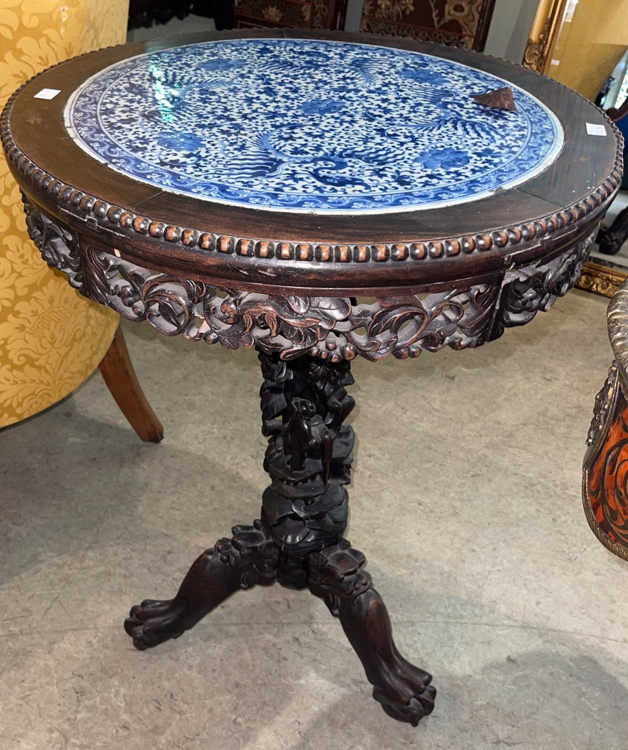 Lot 779 - A Chinese darkwood circular occasional table,...