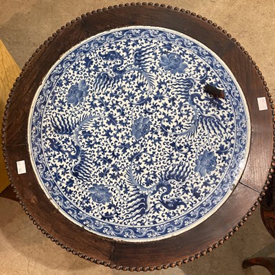 Lot 779 - A Chinese darkwood circular occasional table,...