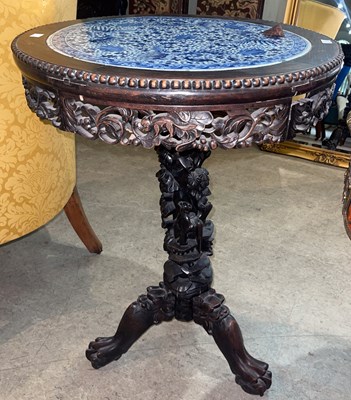 Lot 779 - A Chinese darkwood circular occasional table,...