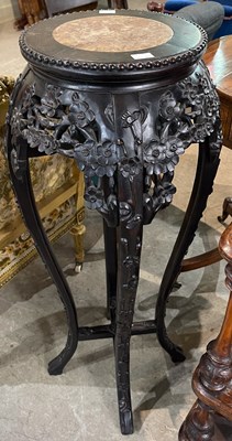 Lot 747 - A Chinese darkwood urn stand, late 19th...