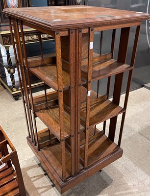 Lot 784 - A late 19th century oak revolving bookcase,...
