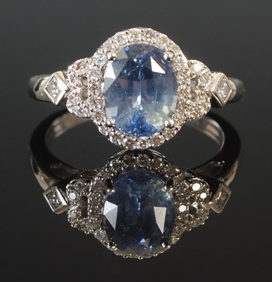 Lot 297 - An 18ct white gold ceylon blue sapphire and...