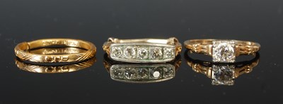 Lot 300B - A white and yellow metal solitaire diamond...