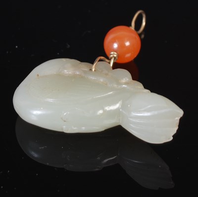 Lot 303 - A Chinese pale celadon jade pendant carved and...