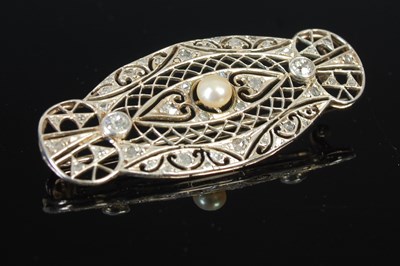 Lot 304C - A white metal diamond and pearl set brooch,...