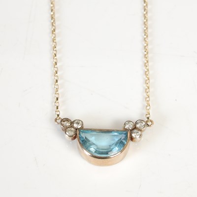 Lot 304D - A 9ct gold necklace suspending yellow metal...