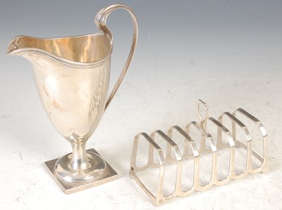 Lot 313 - A Birmingham silver helmet shaped cream jug;...