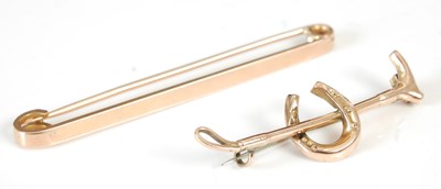Lot 305G - A 9ct gold line brooch, 64.2mm long, 4.7 grams;...
