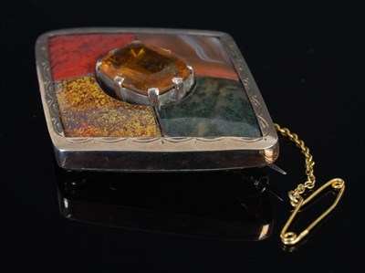 Lot 305I - A yellow metal mounted Scottish pebble set...