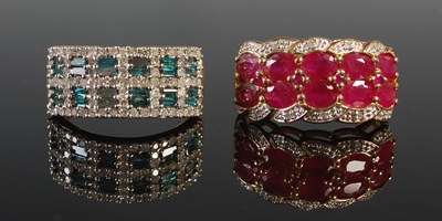 Lot 88 - Two yellow metal gem set dress rings, tests as...