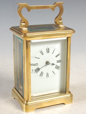 Lot 21 - An early 20th century brass cased carriage...