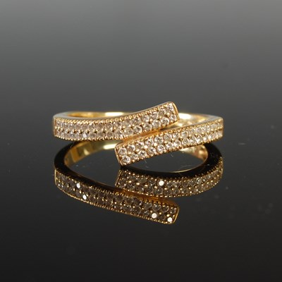 Lot 35 - A yellow metal and diamond dress ring, stamped...