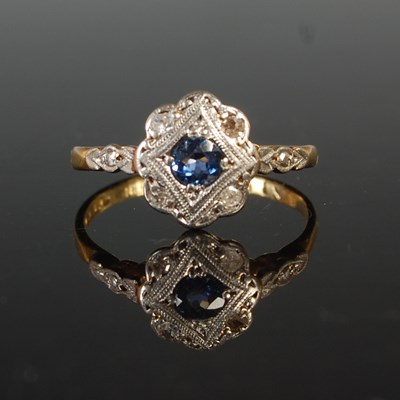 Lot 37 - A white and yellow metal sapphire and diamond...