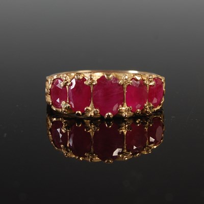 Lot 41 - A 9ct gold and garnet five stone dress ring,...