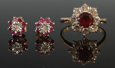Lot 48 - A white metal garnet and diamond cluster ring,...