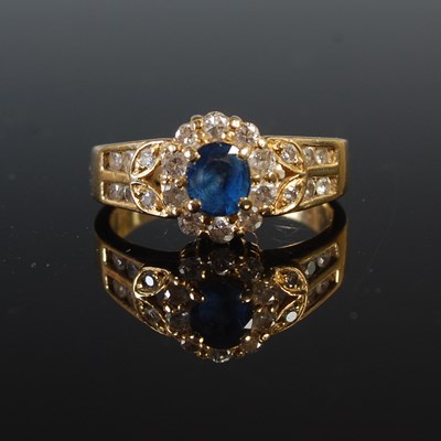 Lot 55 - An 18ct gold sapphire and diamond cluster ring,...