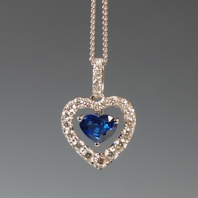 Lot 57 - An 18ct white gold sapphire and diamond...
