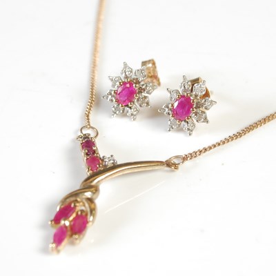 Lot 58 - A yellow metal garnet and diamond pendant,...