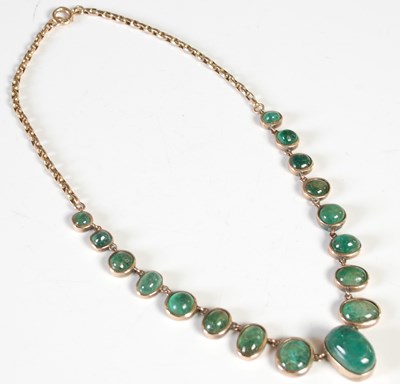 Lot 63 - A yellow metal and emerald cabochon necklace,...