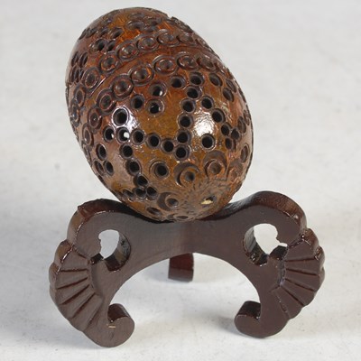 Lot 96 - An antique coquilla nut sewing egg/pomander,...