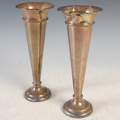 Lot 112 - A pair of London silver bud vases, loaded,...