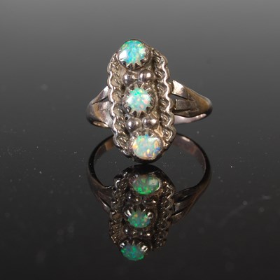 Lot 155 - A silver and opal three stone ring, makers...