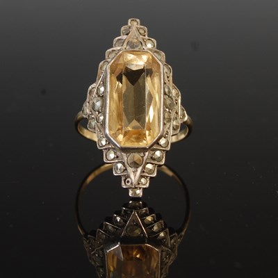Lot 160 - A vintage yellow and white metal dress ring,...