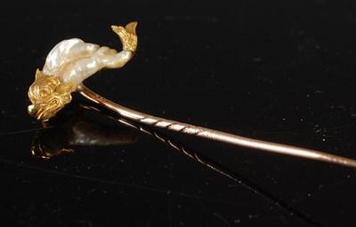 Lot 164 - A gold and Abalone stick pin, topped with a...