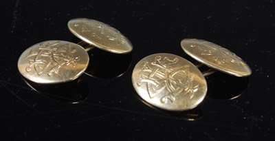Lot 165 - A pair of 18ct gold oval cufflinks, engraved...