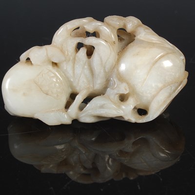 Lot 147 - A Chinese pale celadon jade finger citrus and...