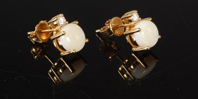 Lot 166 - A pair of 18ct gold opal and diamond stud...