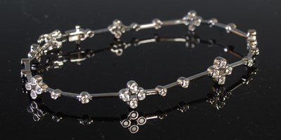 Lot 170 - An 18ct white gold and diamond bracelet,...