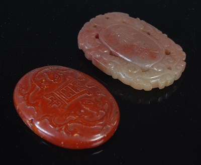 Lot 148 - A Chinese stone pendant, probably jade, oval...