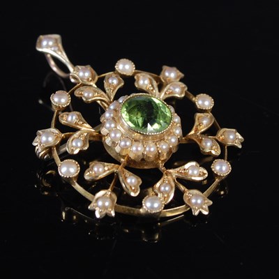 Lot 180 - An early 20th century yellow metal, peridot...