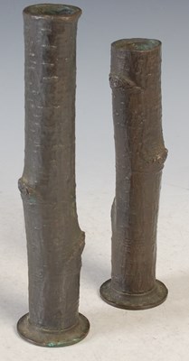 Lot 152 - Two branch form bronze vases, both on circular...