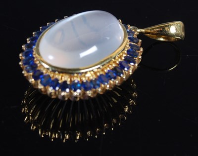 Lot 184 - A yellow metal, moonstone and blue gem stone...