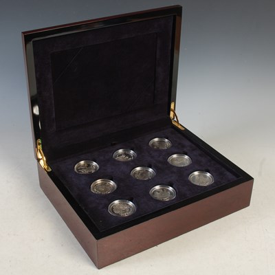 Lot 221 - A coin box containing twelve assorted silver...