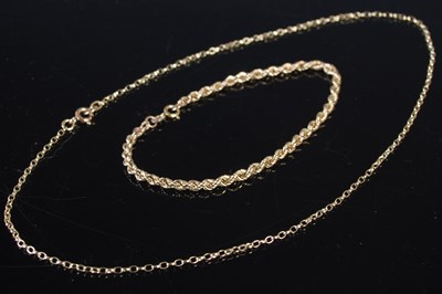 Lot 202 - A 9ct gold bracelet; together with a 9ct gold...