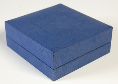 Lot 203 - A yellow metal, blue enamel and diamond set...