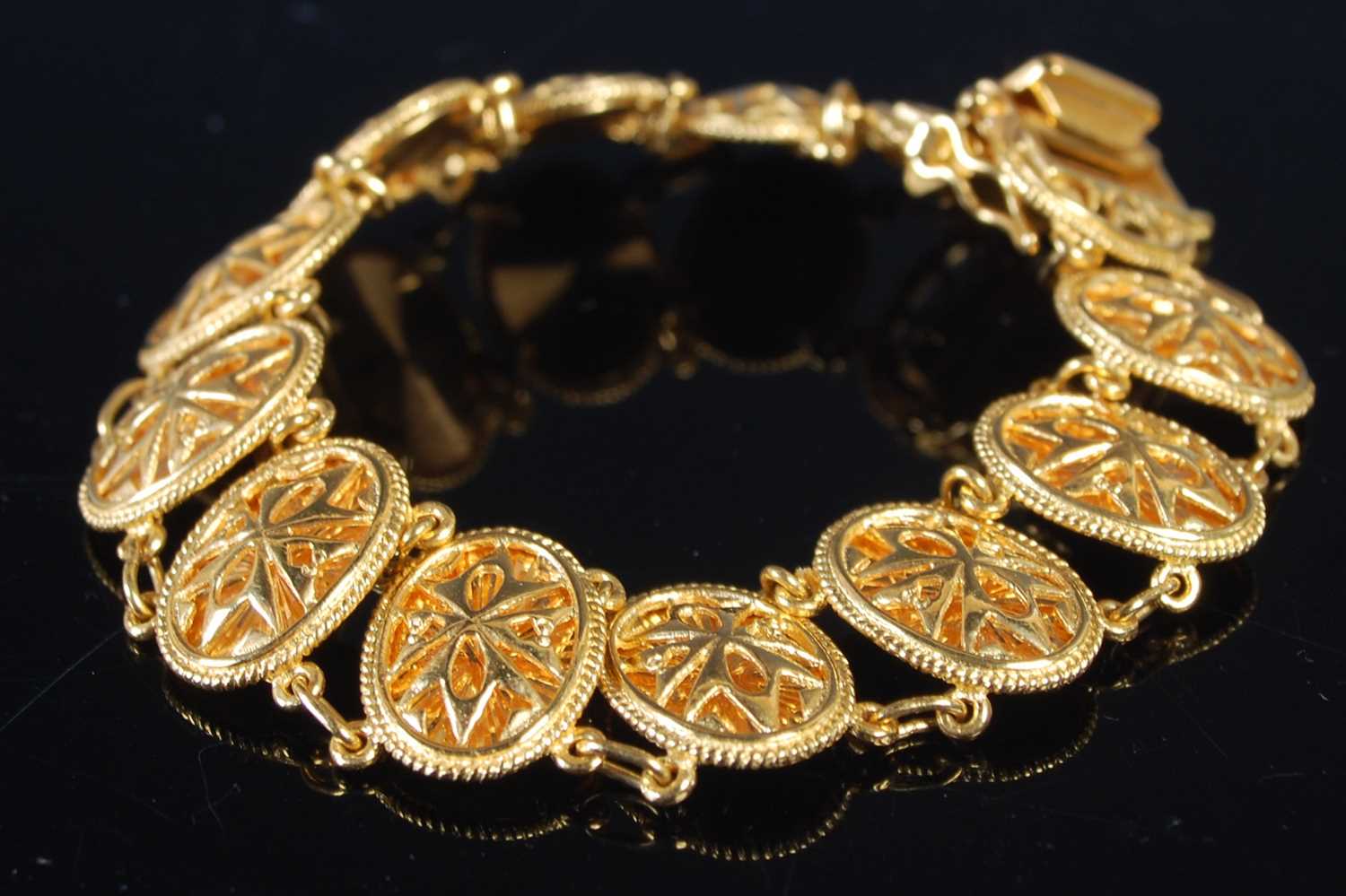 Lot 207 - A high carat yellow metal articulated bracelet,...