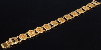Lot 207 - A high carat yellow metal articulated bracelet,...