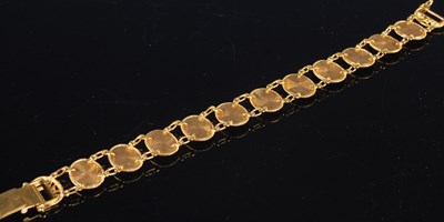 Lot 207 - A high carat yellow metal articulated bracelet,...