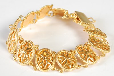 Lot 207 - A high carat yellow metal articulated bracelet,...