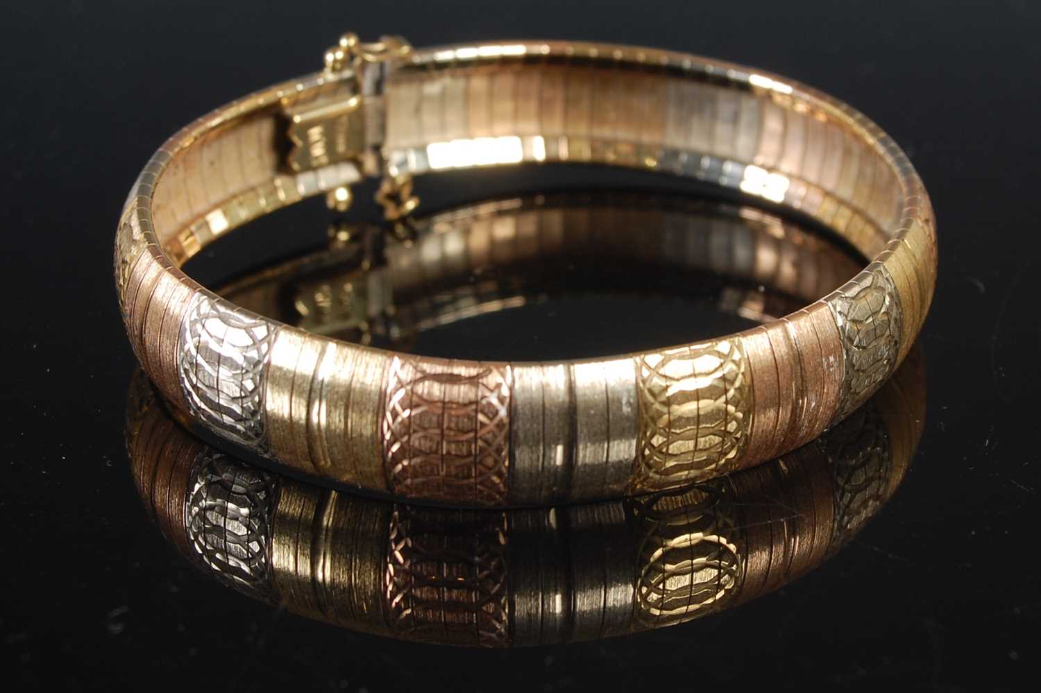 Lot 210 - An Italian tri-colour 18ct gold articulated...