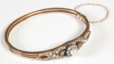 Lot 218 - A yellow metal, split pearl and diamond...