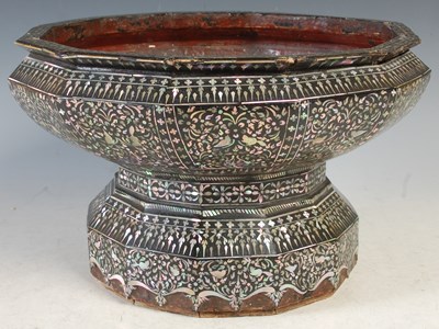 Lot 369 - A carved wood and black lacquer...