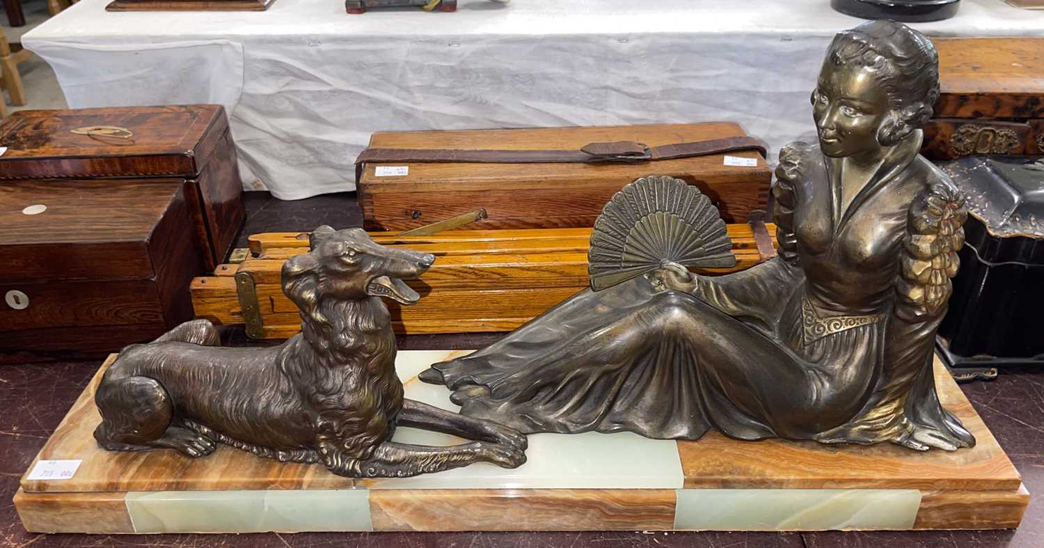 Lot 431 - An Art Deco bronzed spelter figure group of a...