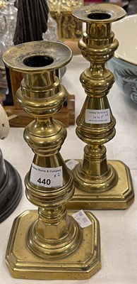 Lot 440 - A pair of antique brass ejector candlesticks,...