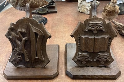 Lot 452 - A pair of carved oak wall brackets, Balliol...